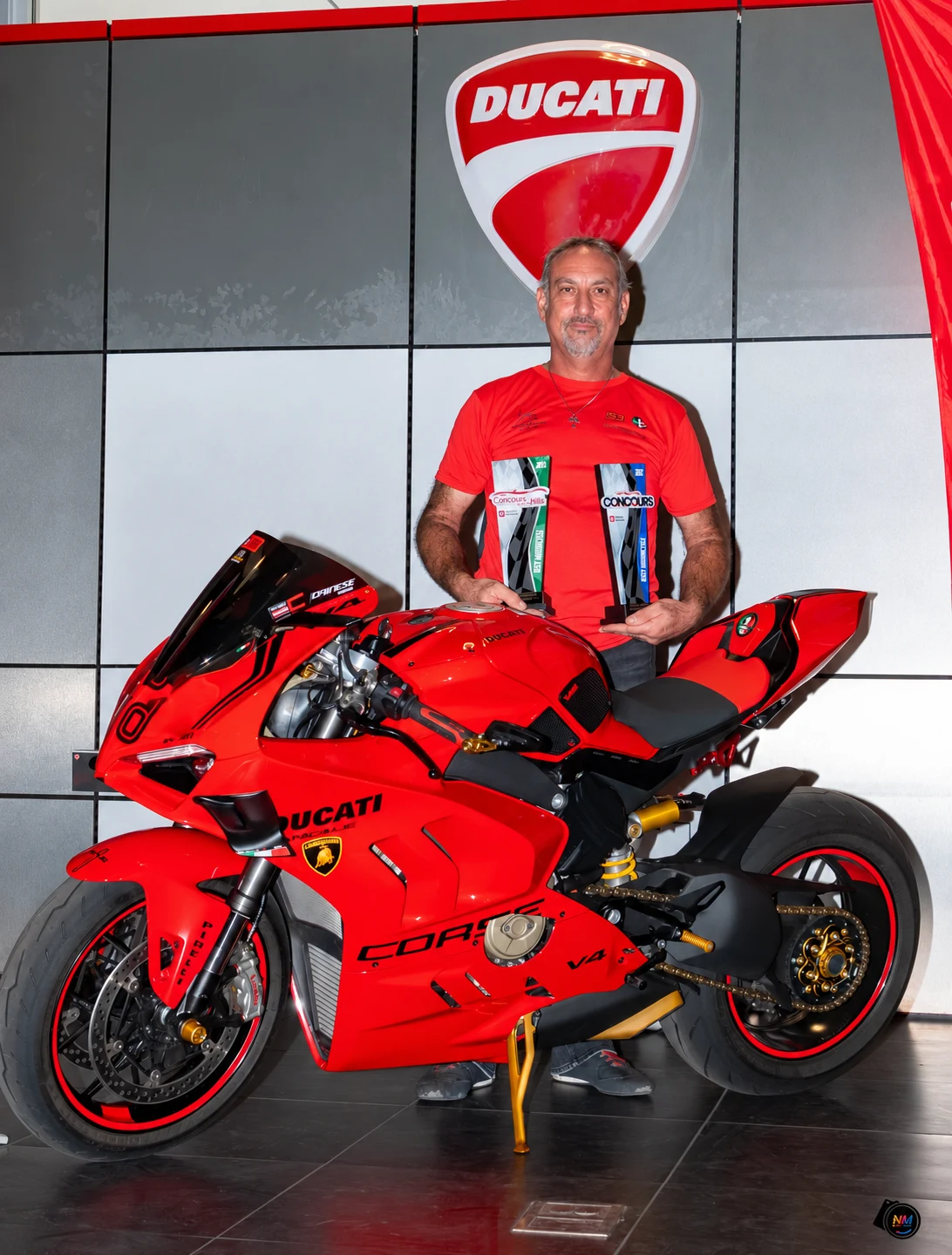 Hagop (Jack) Harutiunian with his 2024 Ducati Panigale V4 and his two Best Motorcycle trophies